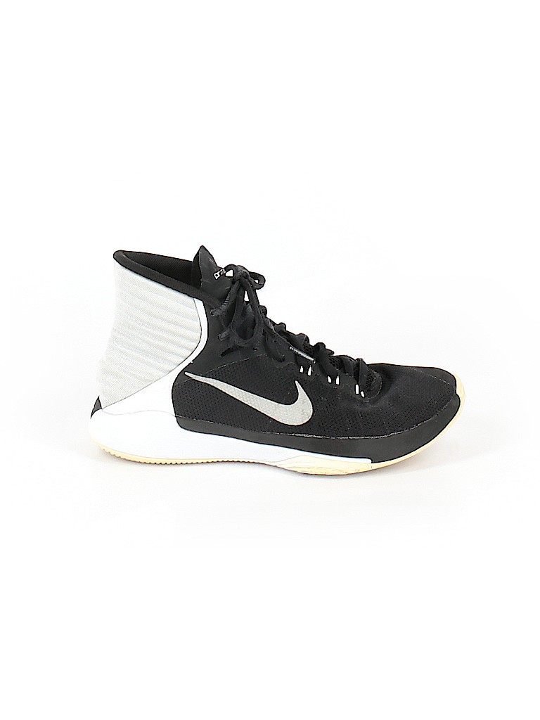 cream and black nike shoes