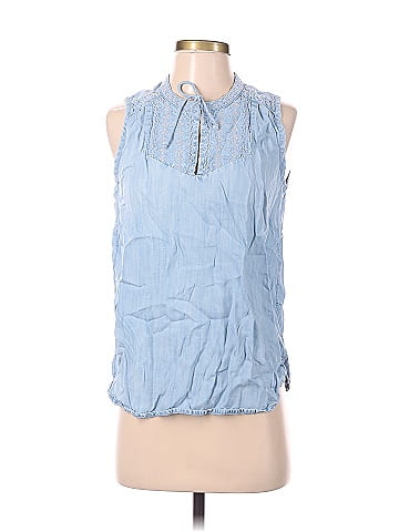 Women's plus size sleeveless blouse in light blue and white