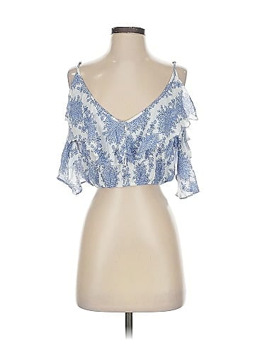 A. Peach Sleeveless Blouse (view 1)