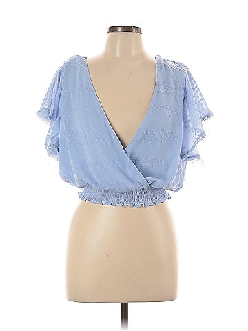 A. Peach Sleeveless Blouse (view 1)