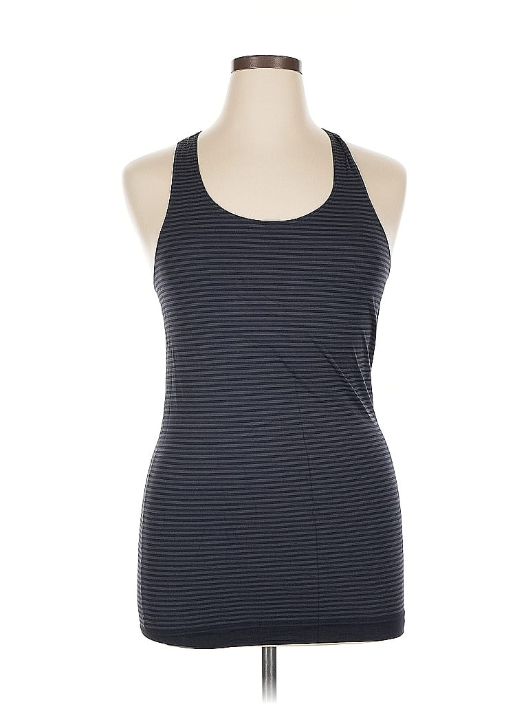 Click to view more detailed imagery on our partner's website Pre-owned Under Armour Tank Top Blue Halter Neckline Tops