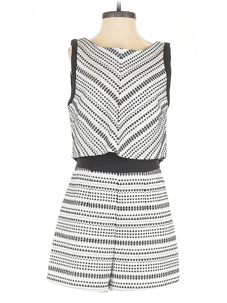 Click to view more detailed imagery on our partner's website Pre-owned Adelyn Rae Romper In White