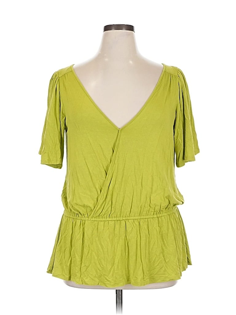 Click to view more detailed imagery on our partner's website Pre-owned Ice Short Sleeve Top Green Plunge Neckline Tops