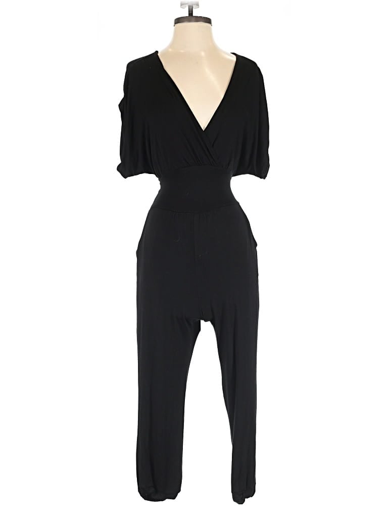 Pre-owned Bebe Jumpsuit In Black