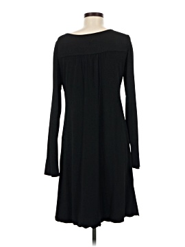 princess polly baby blue dress BCBG Max Azria New York Ready to Wear Autumn Winter Black and brown silk  dress brown belt over a black thin top long sleeves Stock Photo