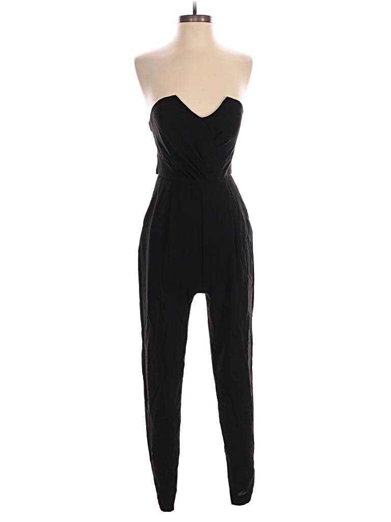 Pre-owned Bebe Jumpsuit In Black